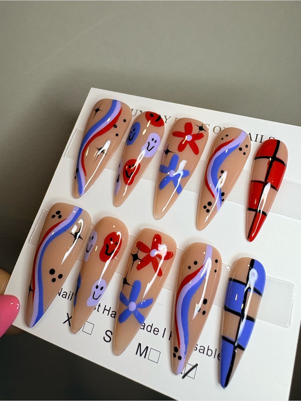 Handpainted Nude Stiletto Press-On Nails with Red & Blue Accents - Picture 1 of 3